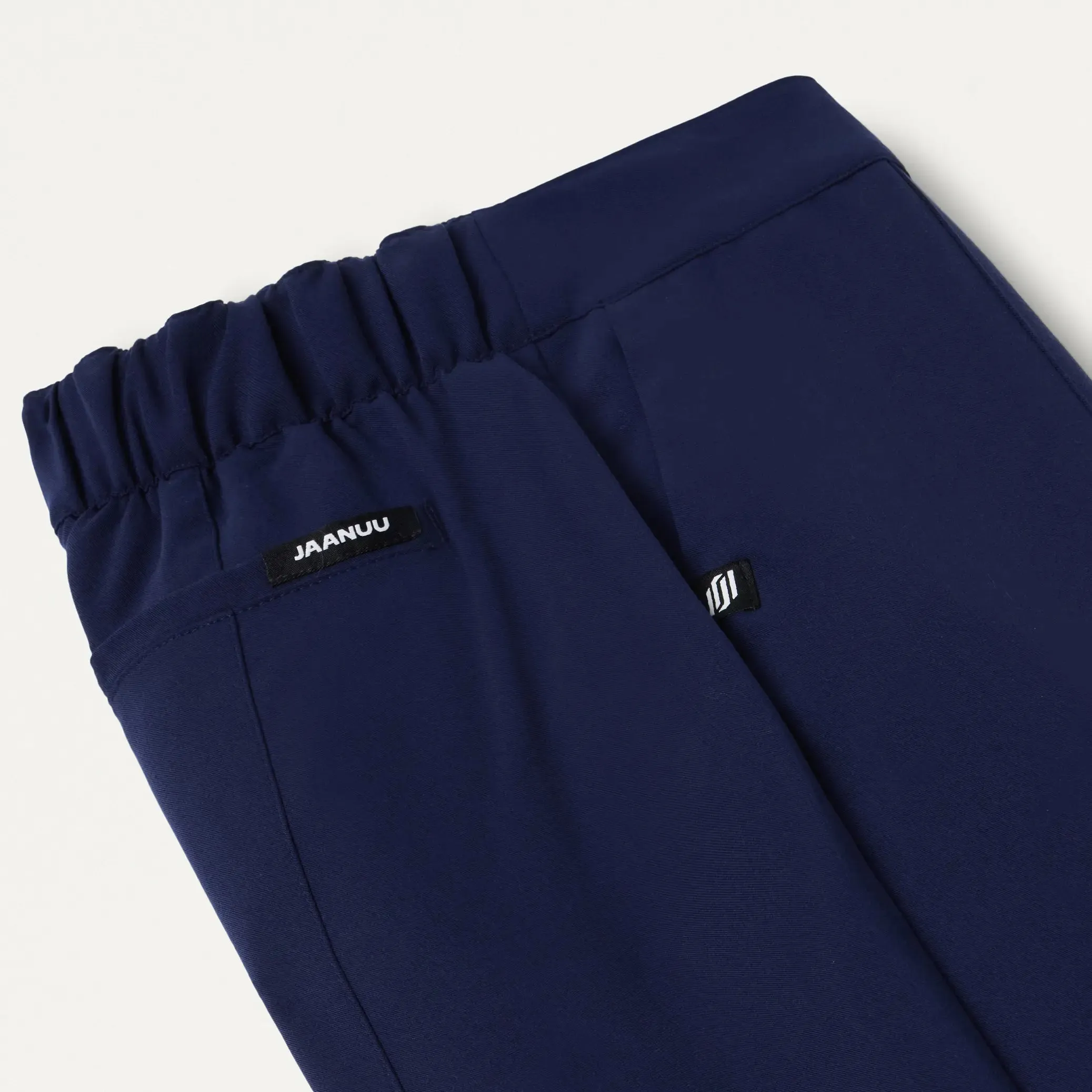 Jaanuu Women's Lio Tapered 5-Pocket Scrub Pant - Midnight Navy